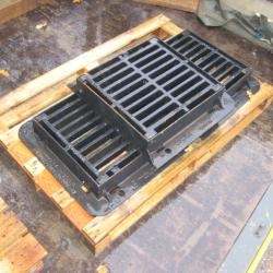 VARIOUS CAST IRON MANHOLES & GRIDS .