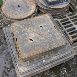 VARIOUS CAST IRON MANHOLES & GRIDS .