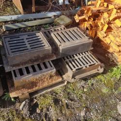 VARIOUS CAST IRON MANHOLES & GRIDS .