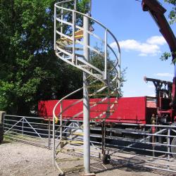 EXTRA HIGH LARGE RECLAIMED STEEL SPIRAL STAIRCASE. APPROX 13FT 6
