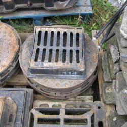 VARIOUS CAST IRON MANHOLES & GRIDS .