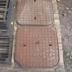 VARIOUS CAST IRON MANHOLES & GRIDS .